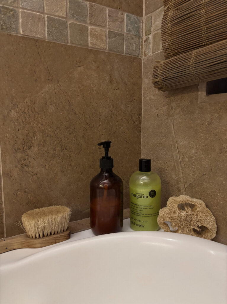 bath products on bathtub ledge part of my night routine checklist